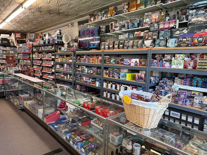 Interior aisle lined with display cases and shelving under a pressed-tin ceiling
