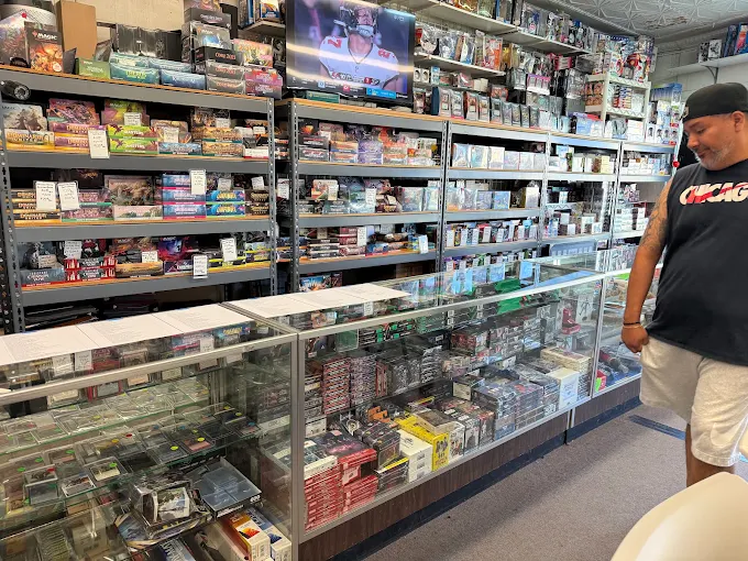 Interior display cases and shelving stocked with sealed boxes and cards