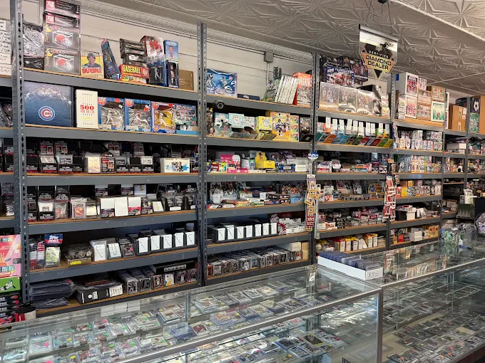 Interior wall of stocked shelving above a long glass display case