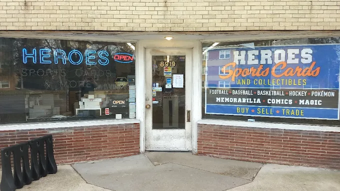 The Heroes Sports Cards storefront on West Cermak Road, with painted window signage and neon lettering